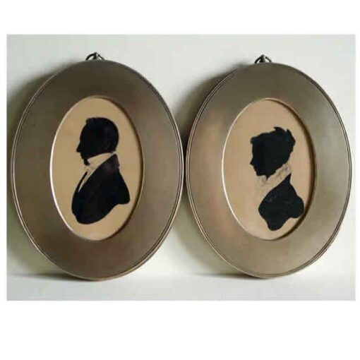 Pair of painted silhouettes in brass frames 1820